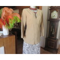 Ultra chic wheat shade slip over long sleeve top in suede look.Brown decor stitching.Size 36 by NEWS