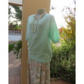 Beautiful handknitted mint green slip over top.Short raglan sleeves.Lace stitch front.Size 44 to 46.