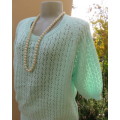 Beautiful handknitted mint green slip over top.Short raglan sleeves.Lace stitch front.Size 44 to 46.