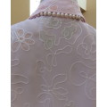 Pretty cool soft pink floral embroidered sheer polyester top.Button down with collar.Size 34. As new