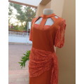 Special occasion burnt orange polycotton stretch dress.Stretch lace sleeves and waist overlay.38/14