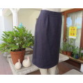 Woolen pencil skirt in navy and thin wheat vertical stripes.Zip and pleat at back. Size 36/12.As new