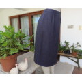 Woolen pencil skirt in navy and thin wheat vertical stripes.Zip and pleat at back. Size 36/12.As new