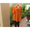 Get noticed in this bright orange short sleeve button down stretch cotton top. DONNA-CLAIRE size 48