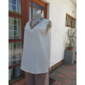 As new rich cream sleeveless cami style slip over top in creased polyester by IN CLOTHING size 36/12