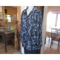 Classic black DONATELLA long sleeve top with grey/blue geometric pattern.Size 46/22.Open collar.