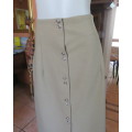 High waisted pickle green bandless button down skirt in heavy polycotton.Low calf length Size 40/16.