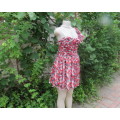 Cheerful mini dress in red/black/white geometric print.Sheer fabric with lining.Size 36/12 by RT.