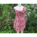Cheerful mini dress in red/black/white geometric print.Sheer fabric with lining.Size 36/12 by RT.