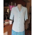 As new short sleeve celeste blue button down top with open collar.Size 34/10 by EXCLUSIV.Open collar