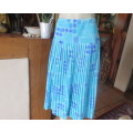 Stunning permanent pleated yoked waist nylon/poly lined skirt.Turquoise/lilac pattern.Size 40/16