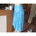 Stunning permanent pleated yoked waist nylon/poly lined skirt.Turquoise/lilac pattern.Size 40/16