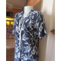 Extra long navy button down short sleeve top,Open collar/slitted sides.White flowers.Size 34/10.