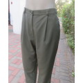 Dress pants in dark olive with tailored side pockets.Pleated front.Tapered legs. ize 36/12.As new