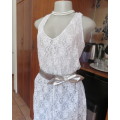 Pretty white/silver floral stretch acrylic lace asymmetrical top size 40/16.V neckline.As new.