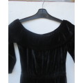 Black glamour stretch poly velvet jumpsuit calf length.Size 30/6.Scooped frilled neckline.As new.