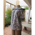 Off the shoulder short sleeve top with shoulder straps in white with blue/yellow flowers.CONTEMPO 36