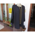 Very black long sleeve slip over 100% rayon richly embroidered/sequined top made in India.Size 46/22