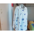 Warm long sleeve white slip over top with blue shells.Zip up front opening and high collar.Size XL