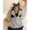 Antique collectible doll 16cm tall with clothing. See all scans. Very good condition.