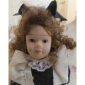 Antique collectible doll 16cm tall with clothing. See all scans. Very good condition.