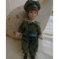 Antique doll 16cm tall with clothing. See all scans. Very good condition