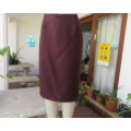 Smart dark mulberry 100% polyester bandless pencil skirt.Zip /slit at back.Size 40 by NEW ERA.As new