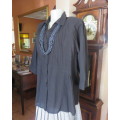 Pretty black cotton button down top with beautiful tucking on front.Band in waist.Size 46.New cond.