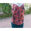 Sexy brick colour strappy top with floral patterns.Button down.Size 34 by RED.Never used.