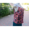 Sexy brick colour strappy top with floral patterns.Button down.Size 34 by RED.Never used.