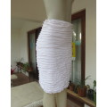 Stunning fully frilled white bodycon lined stretch nylon/polyester skirt,knee length.Size 34/10.