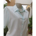 Soft viscose/cotton blend pale mint green embossed vertical striped short sleeve top.Size 40/16.