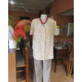 Boutique made polyester button down V neck loose top in cream/brown tiny flowers.Size 44/20