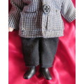 Antique little boy doll in suite with shoes..Movable arms and legs. Length 14cm.