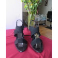 Pair black wedge heel sandals with ankle and crossover straps. Open toes.Size 5 by MRP.As new