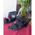 Pair black wedge heel sandals with ankle and crossover straps. Open toes.Size 5 by MRP.As new