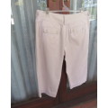 As new cropped 100% cotton pants in beige. Innovative back/front pockets. By INSYNC Plus size 42/18