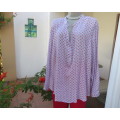 Soft 100% viscose long top in white with tiny red/pink flowers. Banded neckline with V. Size 46.