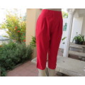 High waisted capri style red best quality pants.Poly/rayon blend. Size 36/12.Stitched front pleats.