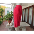 High waisted capri style red best quality pants.Poly/rayon blend. Size 36/12.Stitched front pleats.