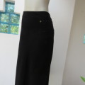 Warm black corduroy A-line band less skirt. One cute pocket. Zip at back. By DONATELLA size 46/22.