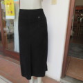 Warm black corduroy A-line band less skirt. One cute pocket. Zip at back. By DONATELLA size 46/22.