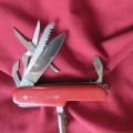 Swiss Gear 10 multitool red folding stainless steel knife. As new
