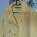 Buttercup yellow IDENTITY size 28/4 girl 13 to 14yr winter`s hooded jacket.Double breast look.As new