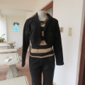 Black double knit long raglan sleeve acrylic bolero. 1 button closure. By FASHION EXPRESS size 36