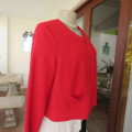 Cherry red long sleeve warm viscose/poly stretch cropped jacket.Button down front. Size 38. New cond