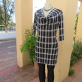 Monochrome check polyester stretch mini dress or long top size 30/6. Waterfall neckline.As new.
