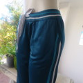Sweatpants in jade polyester with warm inner size 34 by IMAGE Active. Knitted elasticated waistband.