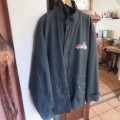 Black parka jacket in heavy cotton fully lined by CARTER HARRIS. Size XXL.Large pockets.Zipped front