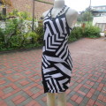 Geometric printed monochrome strappy dress in stretch polyester. Front detail.Size 38 tight/36 loose